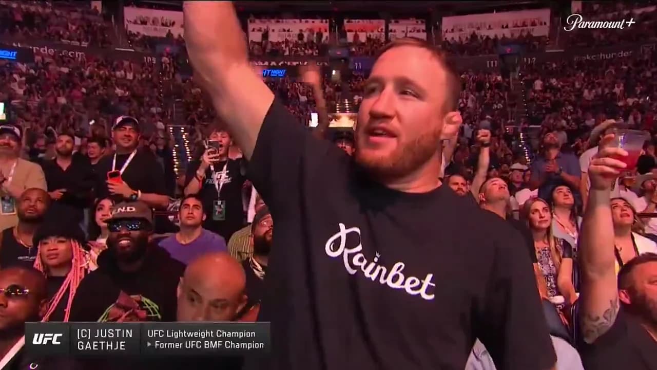 Justin Gaethje in the UFC crowd wearing a black Rainbet shirt